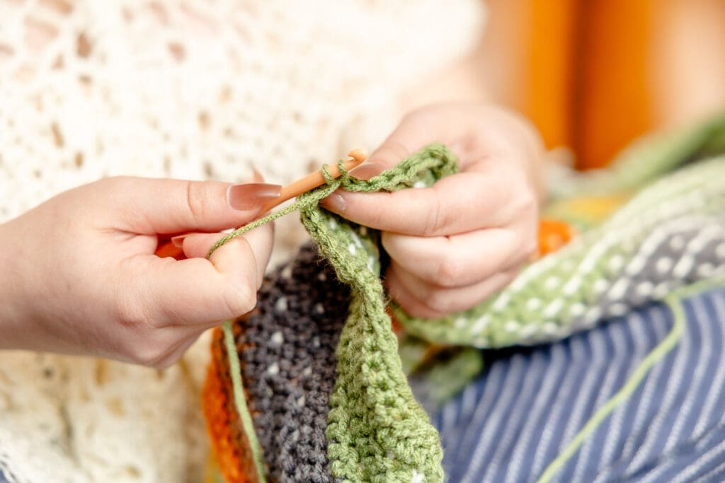 Person works on crochet project | Fiber Artist Brand Photos | Kayla Petrosky Photography
