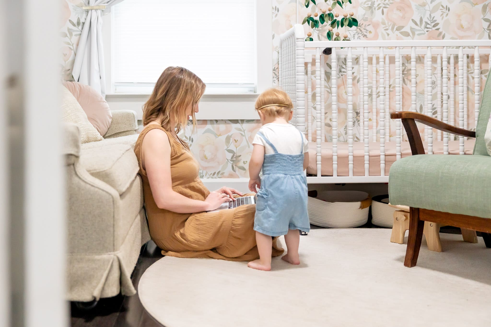 Woman sits on floor to work on laptop while child tries to play with computer | SEO + Marketing Expert Brand Photos | Kayla Petrosky Photography