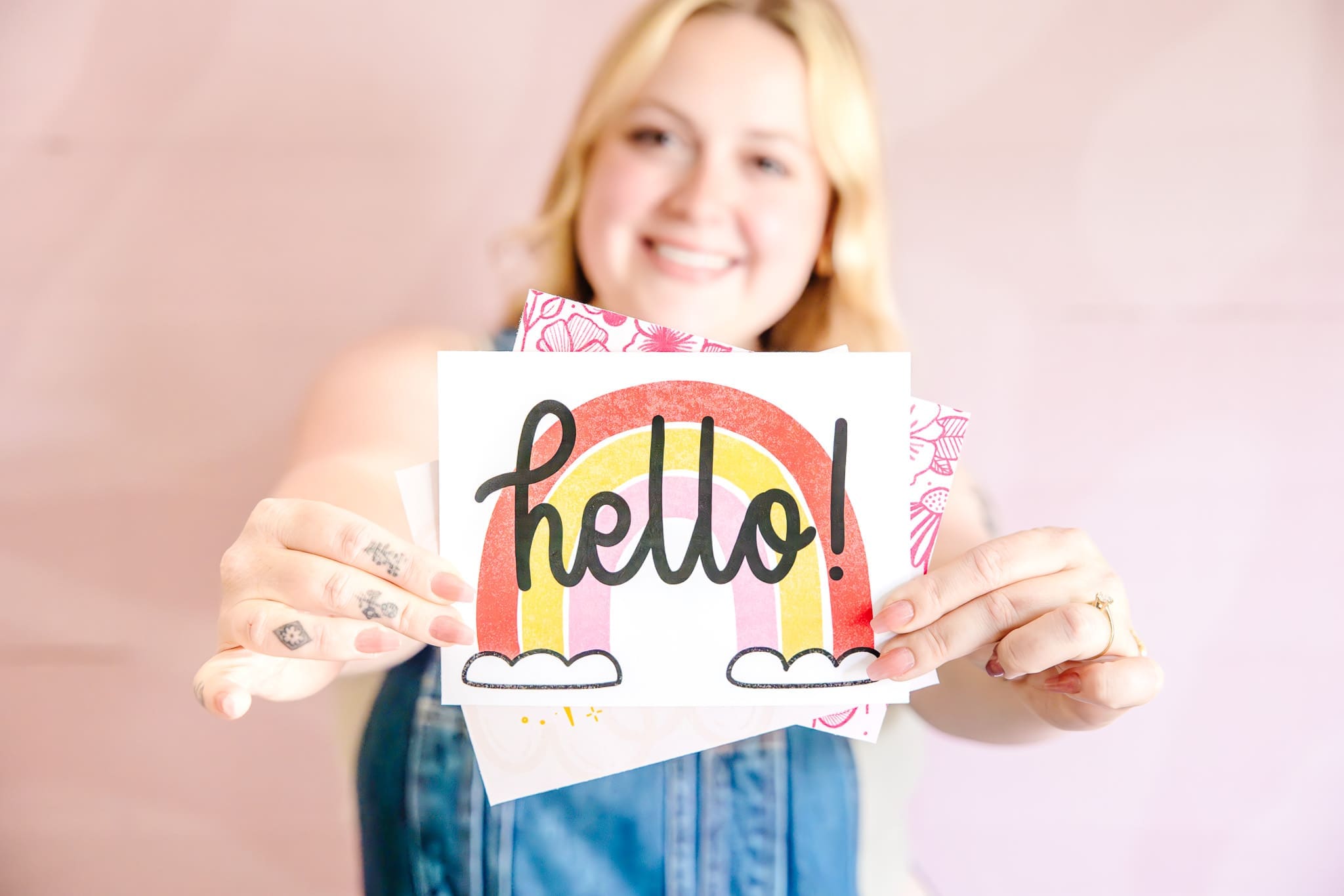 Blonde woman holds a greeting card toward the camera | Brand photos with Lafayette Lettering | Kayla Petrosky Photography