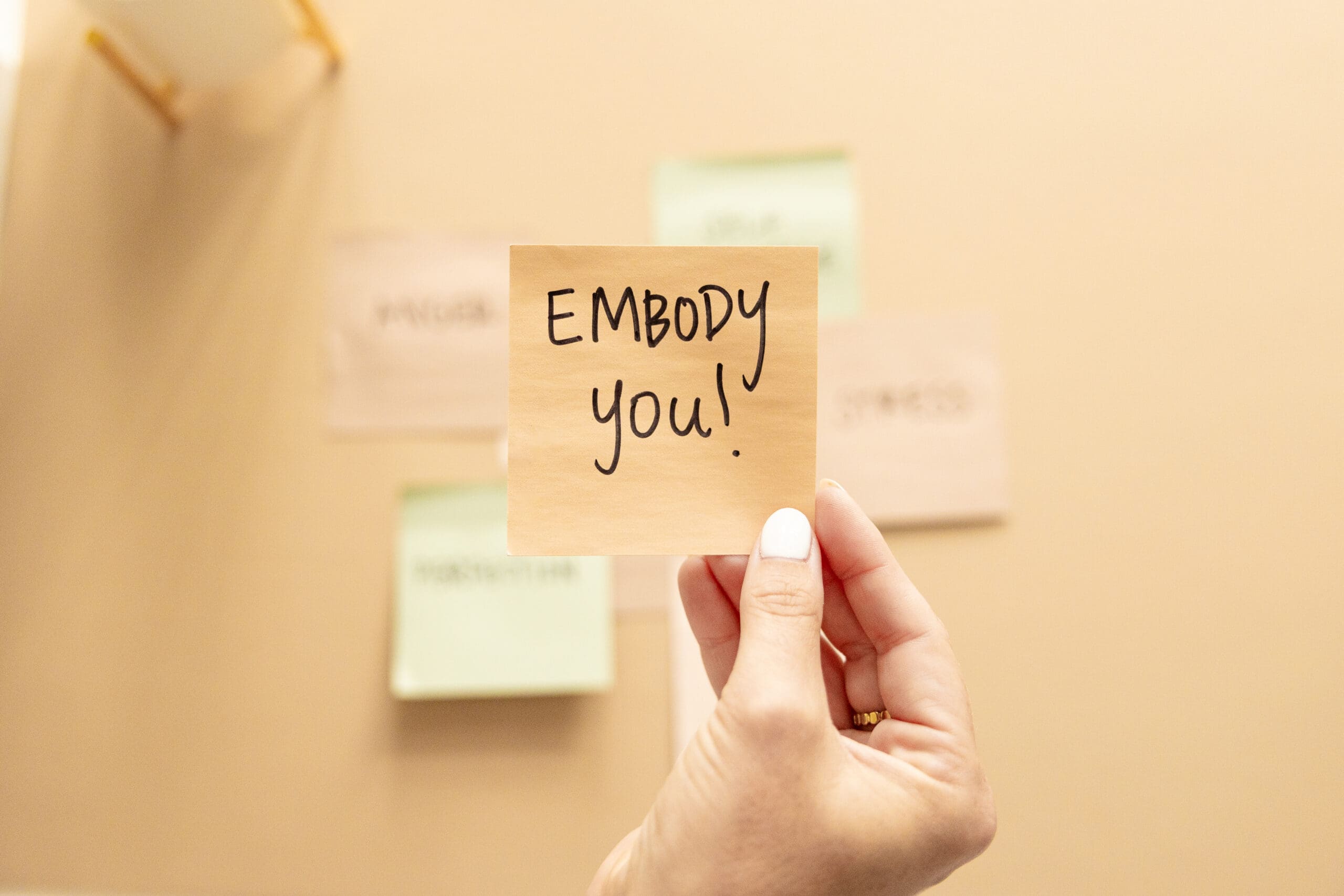 Tan sticky note with handwritten "EMBODY YOU" in black marker | Mindset Coach Brand Photos | Kayla Petrosky Photography