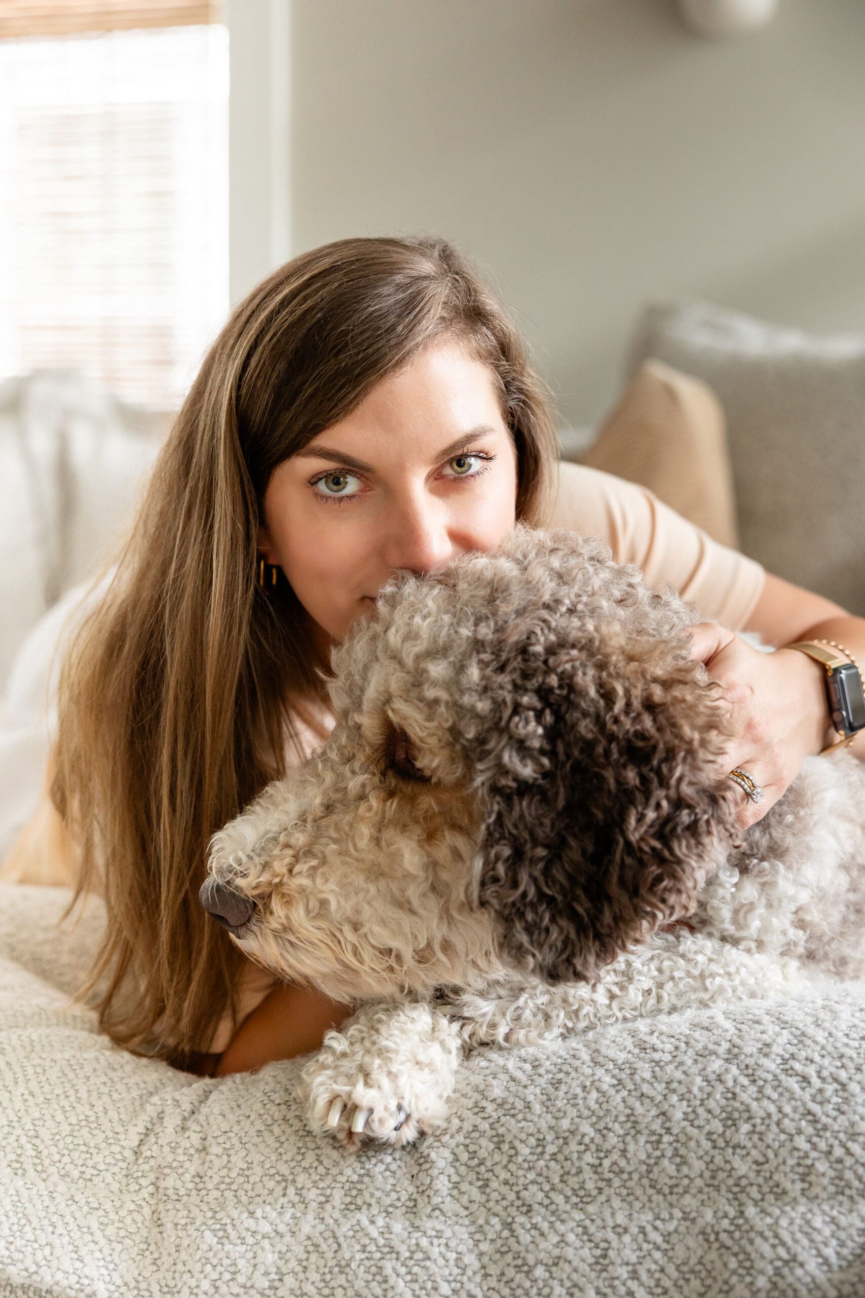 Woman looks into camera while snuggling dog | Mindset Coach Brand Photos | Kayla Petrosky Photography
